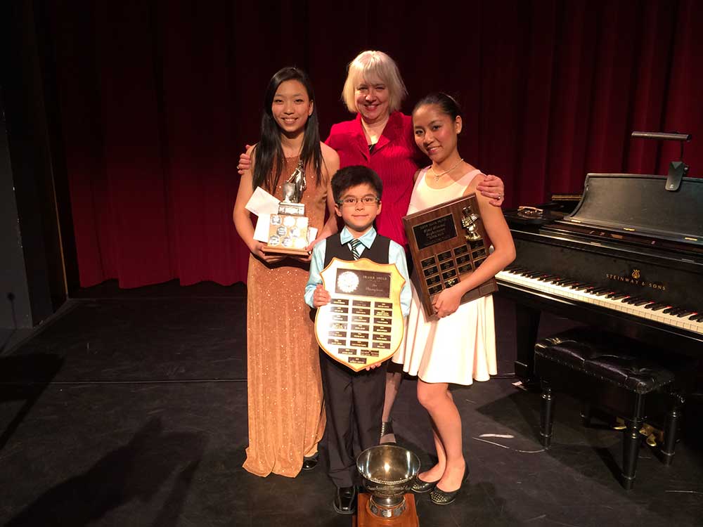 children-with-awards-by-piano-v2 children-with-awards-by-piano-v2