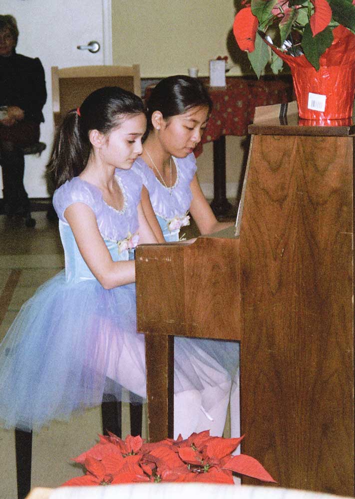 two-young-girls-playing-duet-v2 two-young-girls-playing-duet-v2