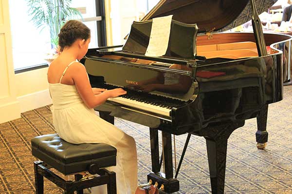 Okan Piano Academy youth Valentina Allenby at piano